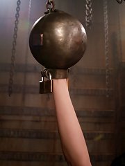 Girl is put in a steel ball hand restraints